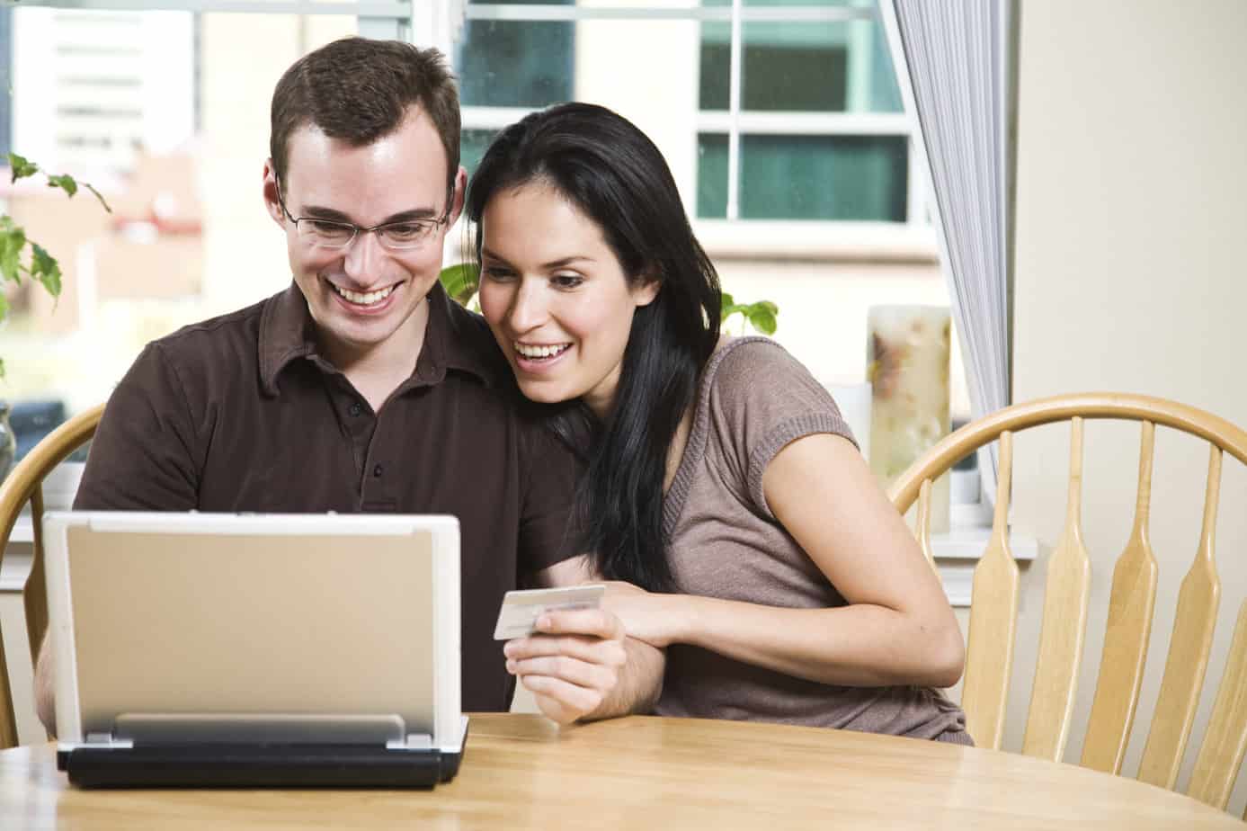 Couple shopping online for insurance quotes